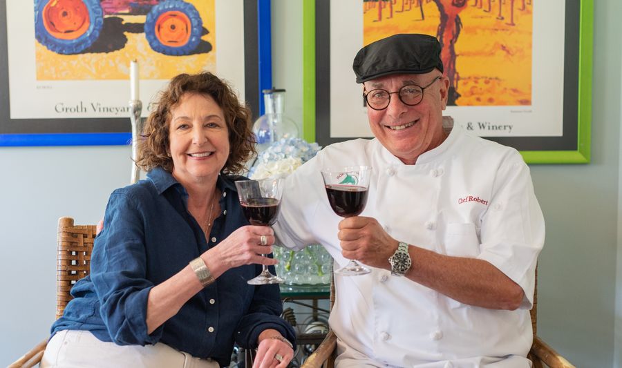 Chef Robert Atchison and Jamie sharing a toast of red wine at home